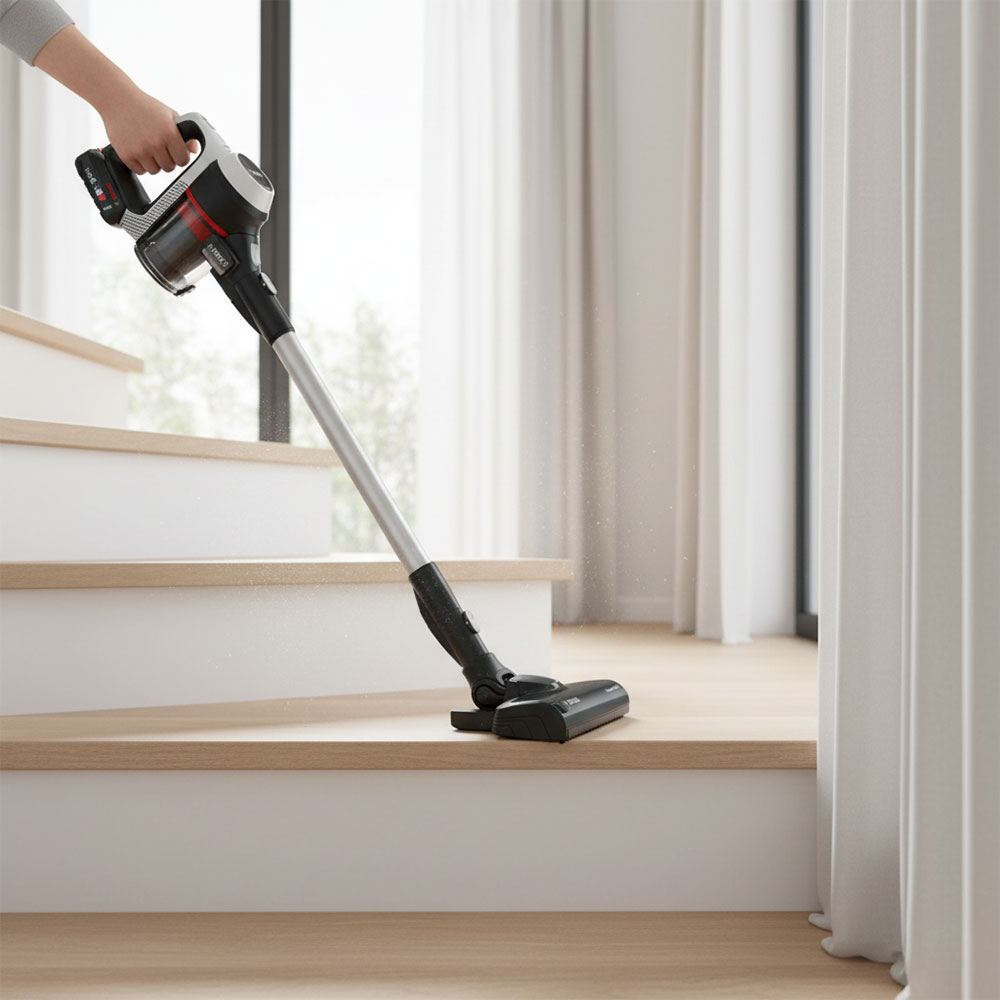 Máy hút bụi không dây hiện đại cầm tay trên cầu thang